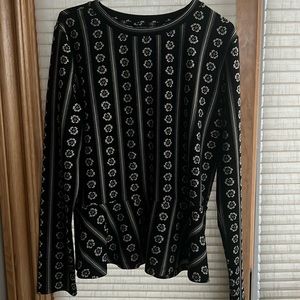 Playful vertical striped knit black with tan flowered Peplum shirt.